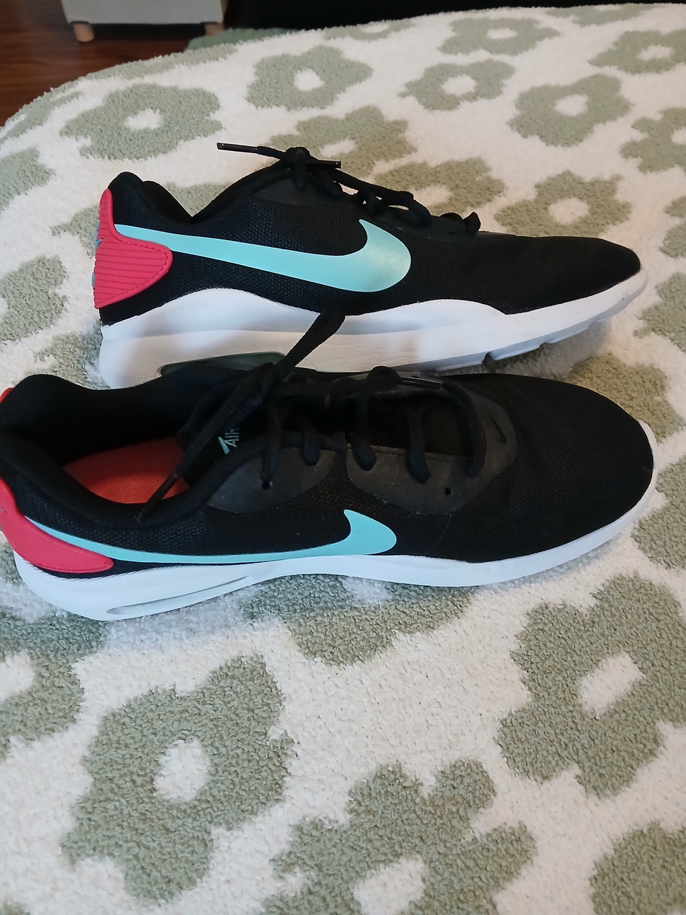 Nike Black Athletic Shoes with Teal Swoosh and Pink Heel Accents